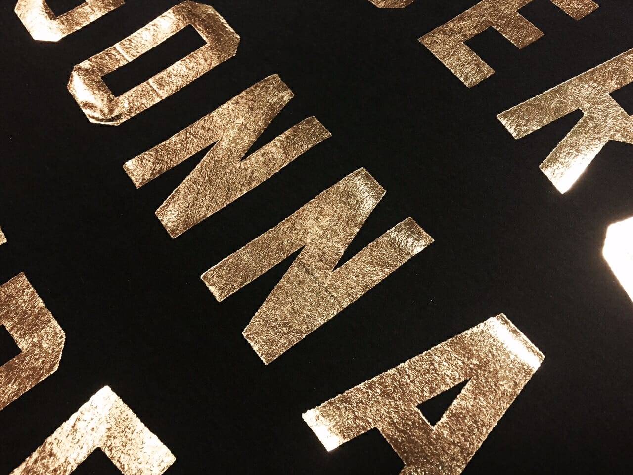 Gold Foil on a Black T-shirt - Marshall Atkinson