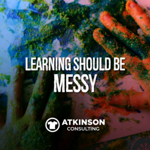 Two hands of a child smearing paint